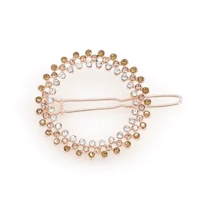 Sparkling champagne and white rhinestone circular barrette with rose gold metal base