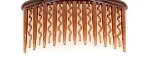 Detailed view of dark amber hair comb with 16 polished round teeth for secure styling
