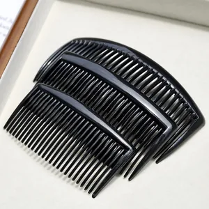 Three-piece set of black plastic hair side combs with curved teeth for hairstyling