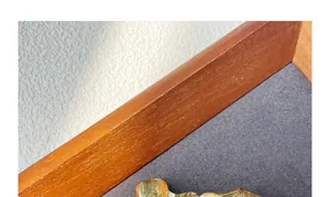 Detailed close-up of golden metal hair clip featuring a unique hammered texture finish