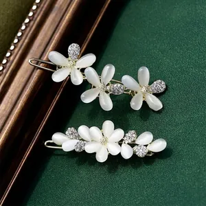 Cat eye stone floral hair clips with gold alloy base and sparkling crystal accents