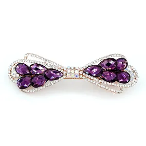 Barrette à cheveux élégante en forme de nœud avec cristaux violets et finition or rose
