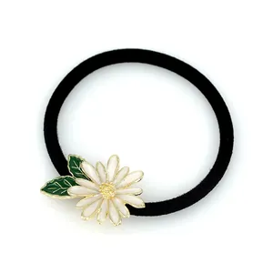 Floral hair tie with white daisy charm and black elastic band for women accessories