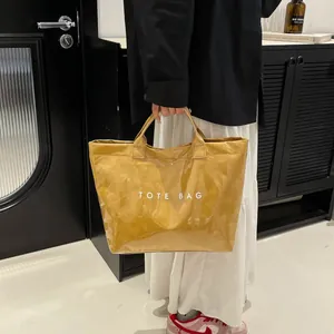 Fashionable large yellow glossy PVC tote bag with Tote Bag lettering for women