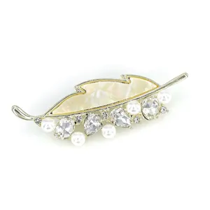 Elegant gold leaf brooch with shell enamel, white pearls and sparkling crystals