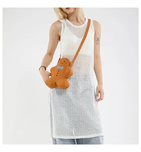 Gingerbread man crossbody bag shown on model for Christmas holiday party decoration