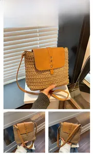 Detail of khaki woven saddle bag with vintage metal buckles and leather strap