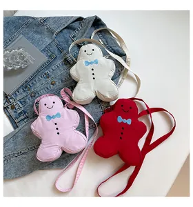 Quilted gingerbread man crossbody bags with detailed embroidery and fabric straps