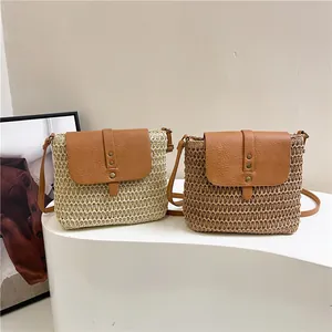 Handmade woven crossbody bags in cream and brown with faux leather accents and metal studs