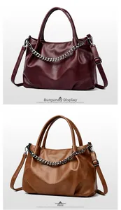 Detail of wine red and tan tote bags with silver chain and adjustable shoulder straps
