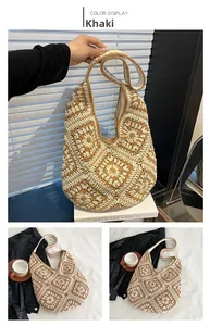 Detailed close-up of khaki crochet shoulder bag with intricate woven floral patterns