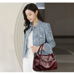 Large burgundy tote bag with silver chain detail, luxury glossy leather shoulder bag