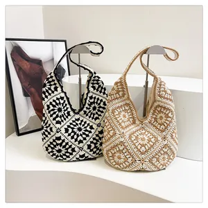 Detail of bohemian crochet tote bags featuring geometric floral knit patterns in two colors