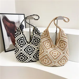 Handmade crochet shoulder bag with vintage floral pattern in black and white styles