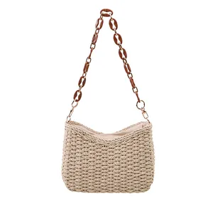 Minimalist straw shoulder bag with amber acrylic chain strap for summer fashion