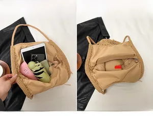 Detail of the woven shoulder bag's large interior main compartment with zipper closure