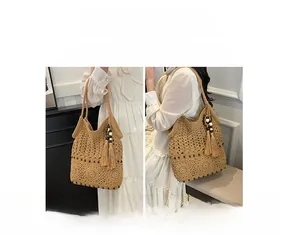 Macro detail of beige crochet beach bag showing woven floral texture and wooden beads