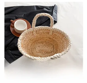 Detail view of the spacious inner storage of a handmade straw bag with floral charm