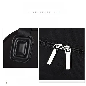 Close-up of dual silver metal zippers and premium buckle on the black nylon bag