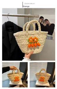 Detailed view of handmade woven straw bag with crochet flowers and carrot charms
