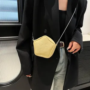 Chic yellow star-shaped crossbody bag with chain strap and quilted pattern for women