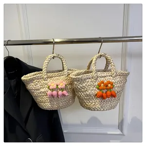 Detail of woven straw tote bags featuring handmade crochet flowers and sturdy handles