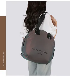 Iridescent large tote bag showing metallic sheen and brand logo with black handles