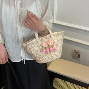 Handmade straw handbag in cream white with pink crochet flowers and tulip charm