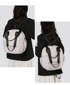 Detail view of large capacity cream shoulder bag with Luck Diamond Paris print