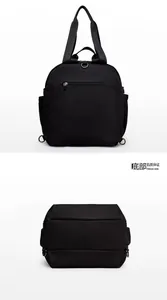 Detail view of the black multi-functional backpack with hidden back zipper and wide bottom