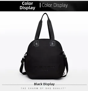 Detail of black crossbody bag with embossed logo and durable nylon texture