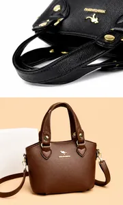 Détail de la poignée confortable et du logo kangourou doré sur des sacs en cuir souple