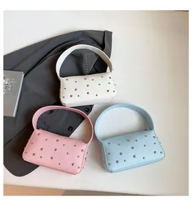 Chic baguette shoulder bags with silver studs in white, pink and light blue colors