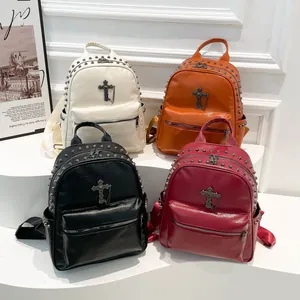 Minimalist faux leather rivet backpacks in four colors with cross pendant and chain detail