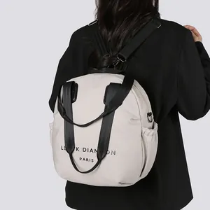 Minimalist beige multi-functional backpack with wide black straps and side pockets