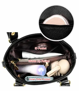 Détails de l'intérieur du sac à main en cuir noir avec compartiments spacieux et organisés