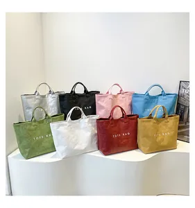 Detailed collection of colorful TOTE BAGS in eight vibrant shades with premium paper texture