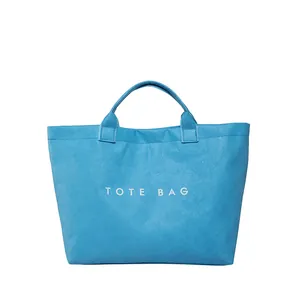 Blue large capacity vintage tote bag featuring white TOTE BAG lettering and textured fabric