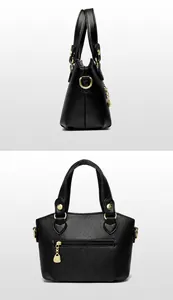Détails du cuir noir grainé et de la fermeture éclair dorée avec motif de kangourou