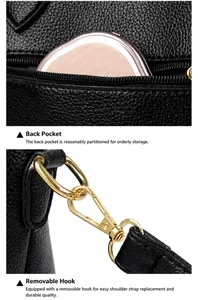 Détail d'un sac à main en cuir noir avec poche zippée à l'arrière et crochets dorés