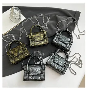 Gothic mini crossbody bags collection with skull, cross and spider pattern metallic prints