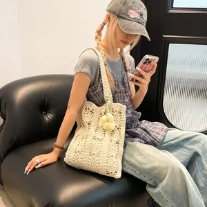 Chic hollow straw tote bag with tulip pendant for summer beach vacations and daily use