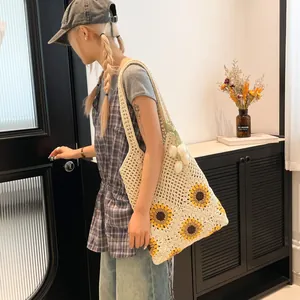 Handmade crochet sunflower tote bag in ivory white, retro aesthetic for summer beach trips