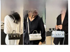 Detailed views of stylish boston bags in marble black, beige, and light blue finishes