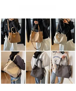 Dettagli della borsa tote in tela che mostrano vari colori e tracolla regolabile