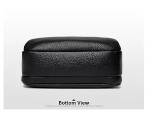 Detailed bottom view of the black round bag showing high-quality lychee grain PU leather texture