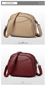 Detail of multi-layer zipper crossbody bags in beige and maroon textured leather