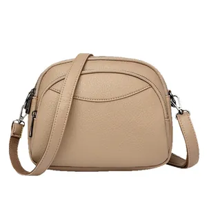 Minimalist khaki PU leather crossbody bag with litchi grain and triple zippers