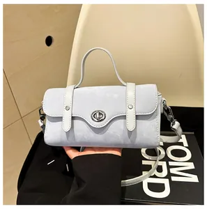 Detail showing the light blue textured faux leather material and silver rotating lock