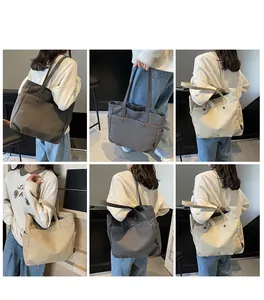Detail view of large canvas tote bag showing side pockets and front button pocket in two colors